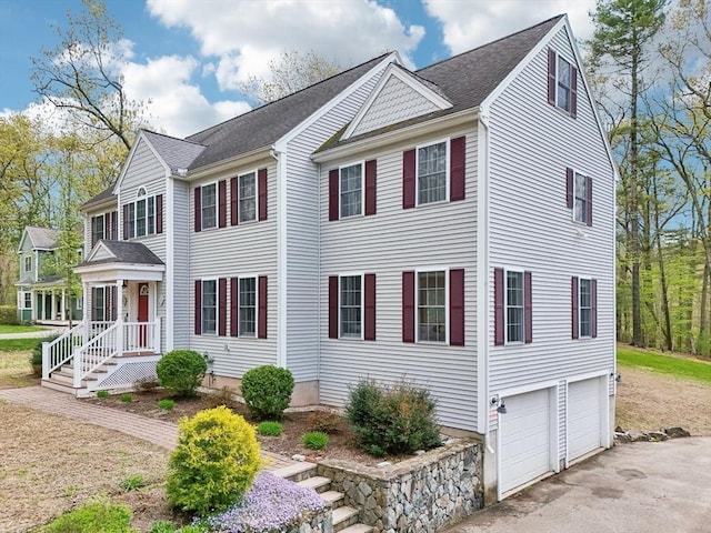 7 Acorn Way, Georgetown, MA 01833 - view of front of house with an attached garage, driveway, and roof with shingles