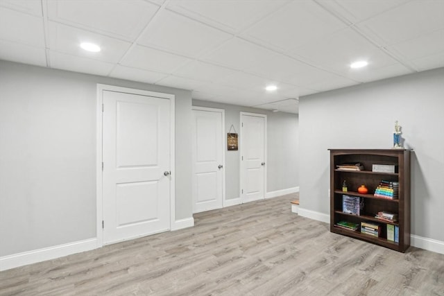 7 Acorn Way, Georgetown, MA 01833 - finished below grade area featuring wood finished floors, baseboards, recessed lighting, and a drop ceiling