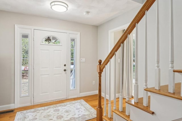 7 Acorn Way, Georgetown, MA 01833 - entryway featuring stairs, light wood-style floors, and baseboards