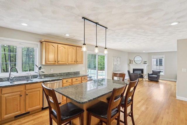 7 Acorn Way, Georgetown, MA 01833 - kitchen featuring stainless steel dishwasher, a breakfast bar area, a sink, plenty of natural light, and recessed lighting