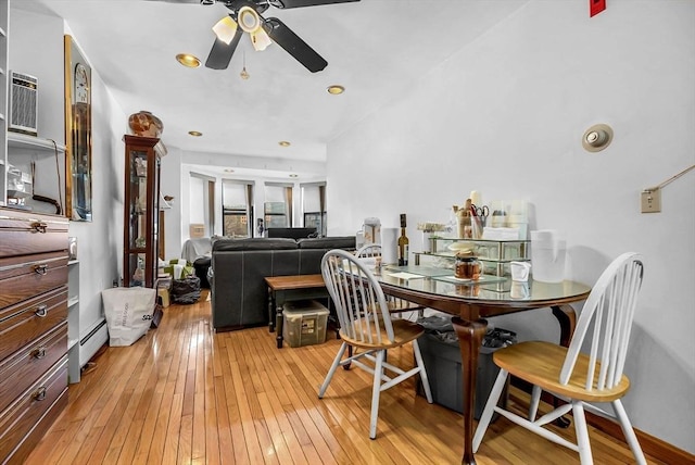 dining room with ceiling fan and light hardwood / wood-style floors