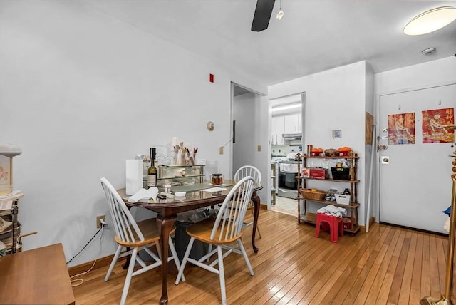 dining space featuring ceiling fan and light hardwood / wood-style floors