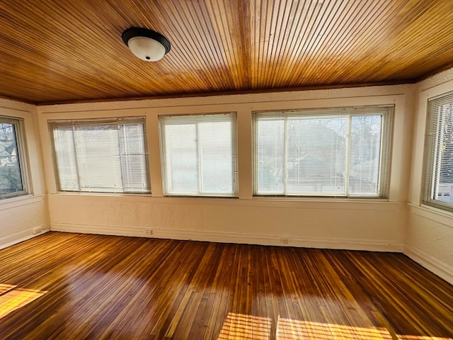 unfurnished sunroom with wood ceiling