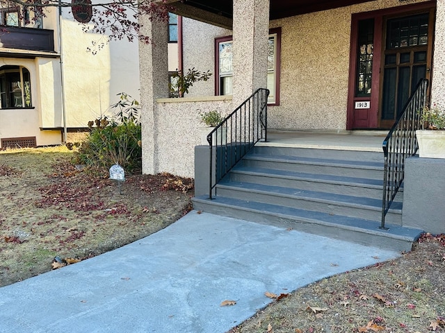 entrance to property featuring a porch