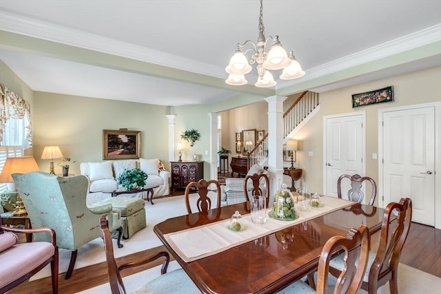29 Shinglewood, Plymouth, MA 02360 - dining space with wood finished floors, a chandelier, stairway, decorative columns, and ornamental molding