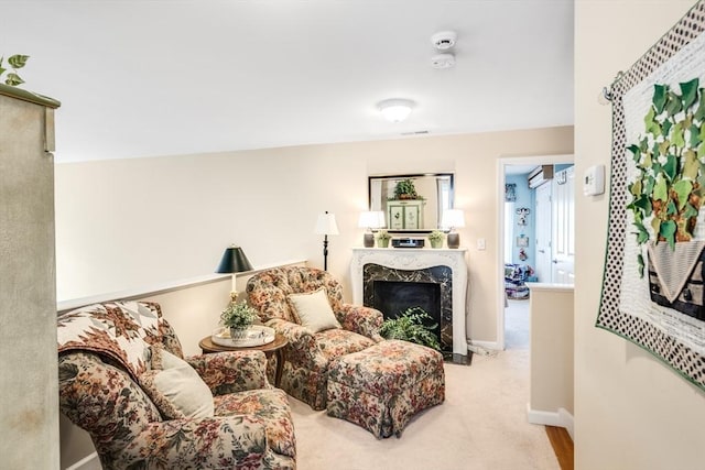 29 Shinglewood, Plymouth, MA 02360 - living area featuring a premium fireplace, baseboards, and light colored carpet