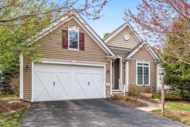 29 Shinglewood, Plymouth, MA 02360 - view of front of property with driveway and an attached garage