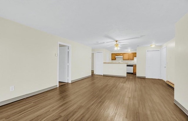 unfurnished living room featuring wood finished floors, ceiling fan, a baseboard radiator, and baseboards