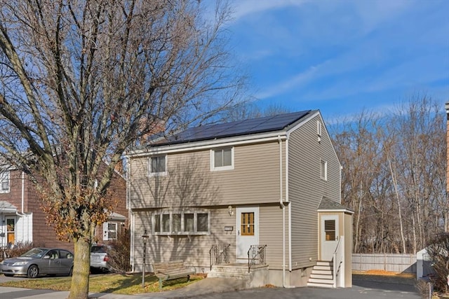 view of front of home with solar panels