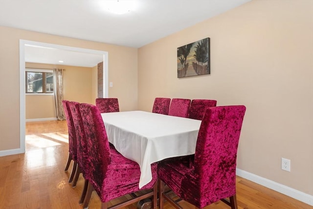 dining room with hardwood / wood-style floors