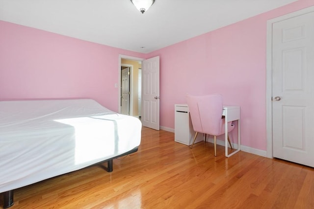 bedroom with wood-type flooring