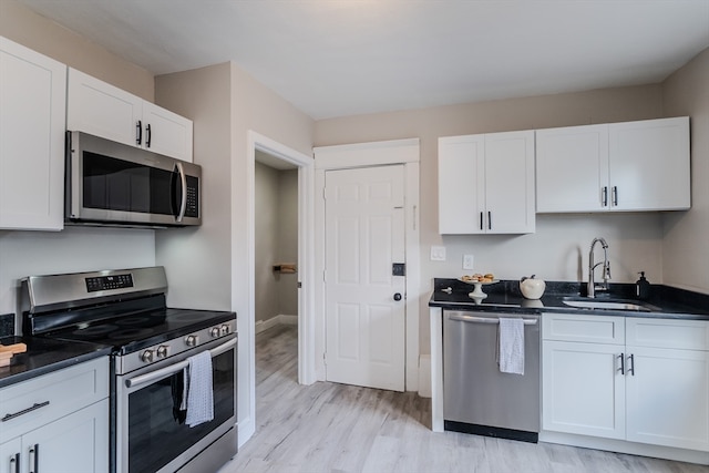 kitchen with white cabinetry and appliances with stainless steel finishes