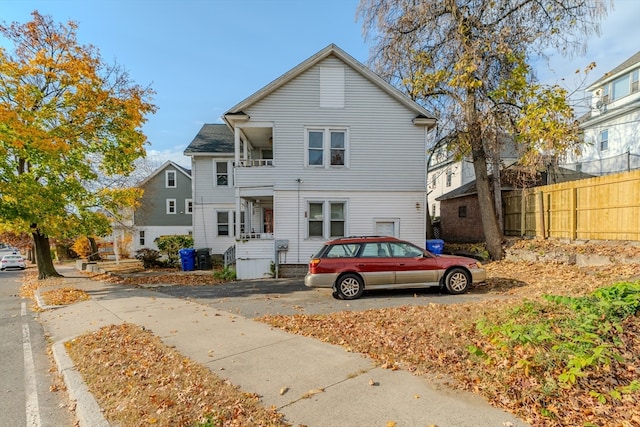 view of front of house featuring a balcony