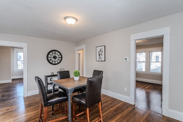 dining area featuring dark hardwood / wood-style floors and plenty of natural light