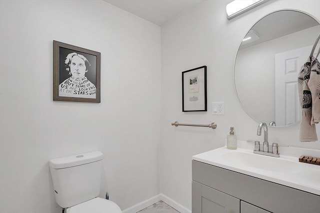 37 Revere St, Springfield, MA 01108 - bathroom featuring marble look tile flooring, toilet, vanity, and baseboards