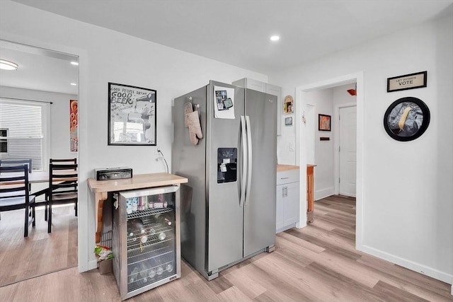 37 Revere St, Springfield, MA 01108 - kitchen with stainless steel refrigerator with ice dispenser, wine cooler, light wood-style floors, recessed lighting, and baseboards