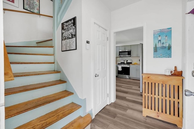 37 Revere St, Springfield, MA 01108 - stairs featuring wood finished floors