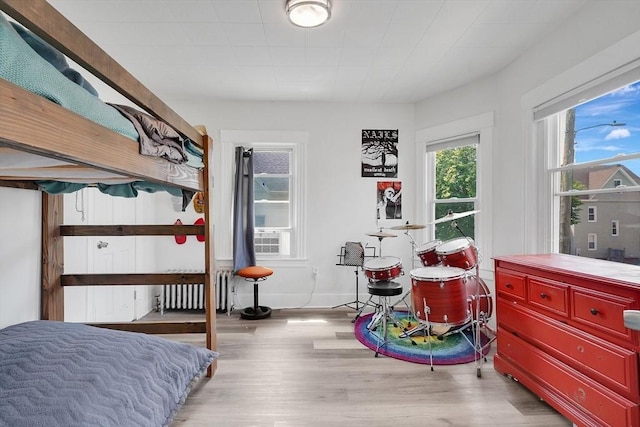 37 Revere St, Springfield, MA 01108 - bedroom featuring radiator heating unit and wood finished floors
