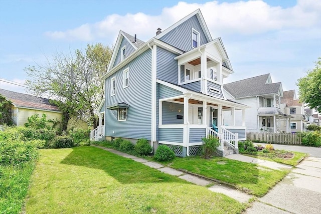 37 Revere St, Springfield, MA 01108 - view of front facade featuring covered porch, a front yard, and a chimney