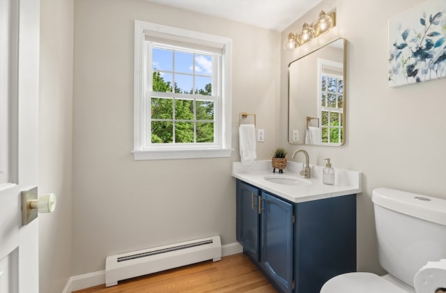 3 Penni Ln, Andover, MA 01810 - half bathroom featuring baseboard heating, vanity, and wood finished floors