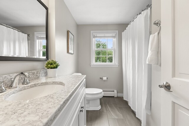 3 Penni Ln, Andover, MA 01810 - full bath featuring vanity, a baseboard heating unit, and a shower with shower curtain