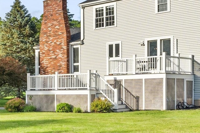 3 Penni Ln, Andover, MA 01810 - rear view of property featuring a chimney, a lawn, and a deck