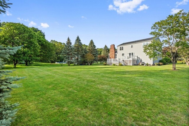 3 Penni Ln, Andover, MA 01810 - view of green lawn featuring a deck and stairs