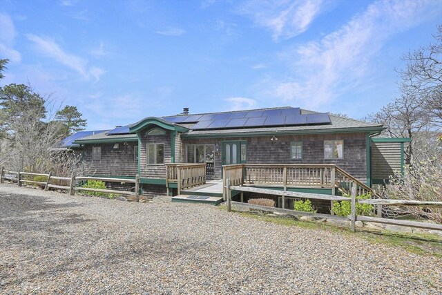 79 David Ave, Tisbury, MA 02568 - view of front of property with solar panels and a wooden deck