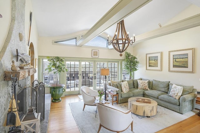 79 David Ave, Tisbury, MA 02568 - living area featuring wood finished floors, plenty of natural light, a chandelier, beam ceiling, and high vaulted ceiling