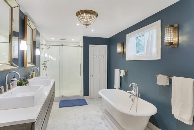 79 David Ave, Tisbury, MA 02568 - full bathroom with a shower stall, a soaking tub, double vanity, and recessed lighting