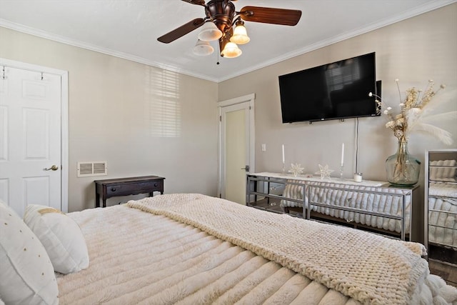 bedroom with ceiling fan and crown molding