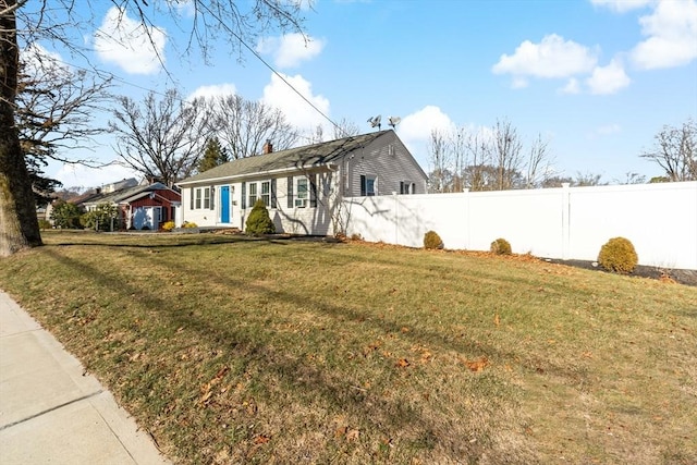 view of property exterior with a lawn