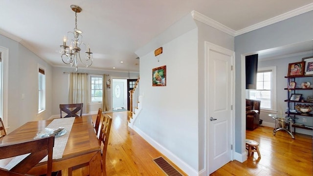 33 Jarvis St, Revere, MA 02151 - dining room with crown molding, light wood-type flooring, a chandelier, baseboards, and recessed lighting