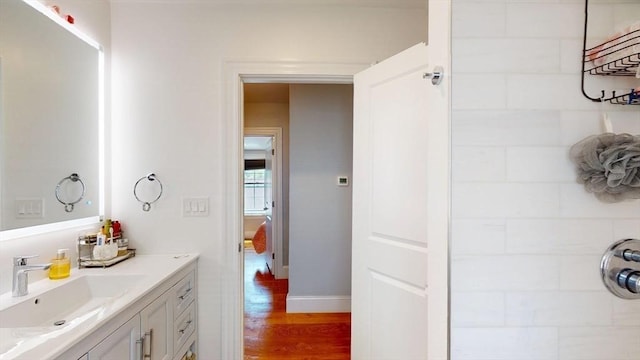 33 Jarvis St, Revere, MA 02151 - bathroom featuring vanity, wood finished floors, and baseboards