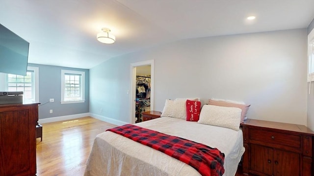33 Jarvis St, Revere, MA 02151 - bedroom with vaulted ceiling, light wood finished floors, baseboards, and a spacious closet