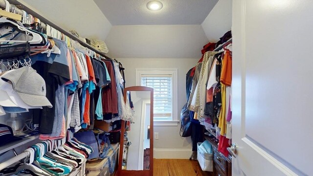 33 Jarvis St, Revere, MA 02151 - spacious closet featuring light wood-style floors and vaulted ceiling