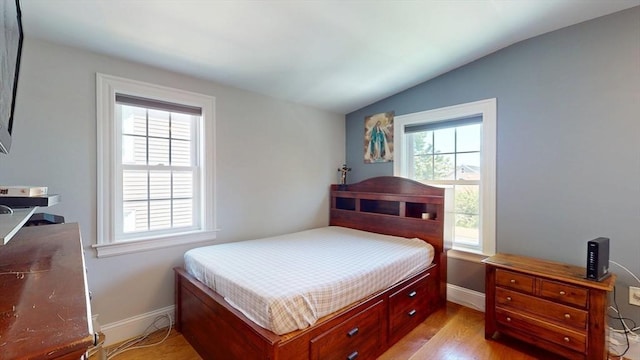 33 Jarvis St, Revere, MA 02151 - bedroom featuring vaulted ceiling, baseboards, and light wood-style floors