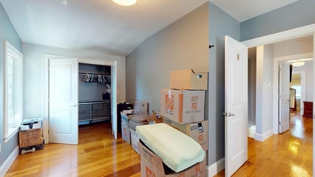 33 Jarvis St, Revere, MA 02151 - bedroom featuring light wood-style flooring, a closet, multiple windows, and vaulted ceiling