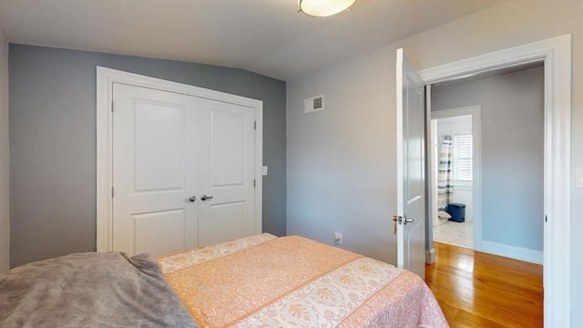 33 Jarvis St, Revere, MA 02151 - bedroom with wood finished floors, a closet, lofted ceiling, and baseboards