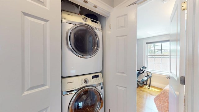 33 Jarvis St, Revere, MA 02151 - washroom with stacked washer / drying machine and wood finished floors