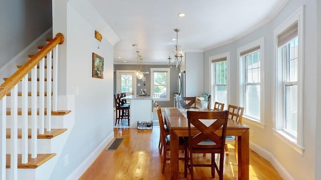 33 Jarvis St, Revere, MA 02151 - dining room featuring stairs, crown molding, light wood-type flooring, baseboards, and recessed lighting