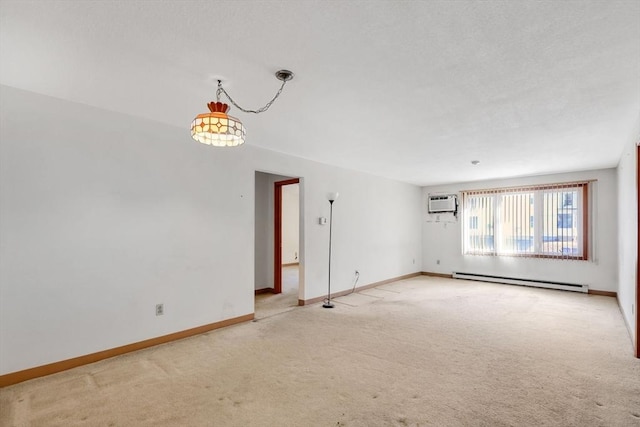 unfurnished room with baseboard heating, a wall mounted AC, light carpet, a textured ceiling, and baseboards