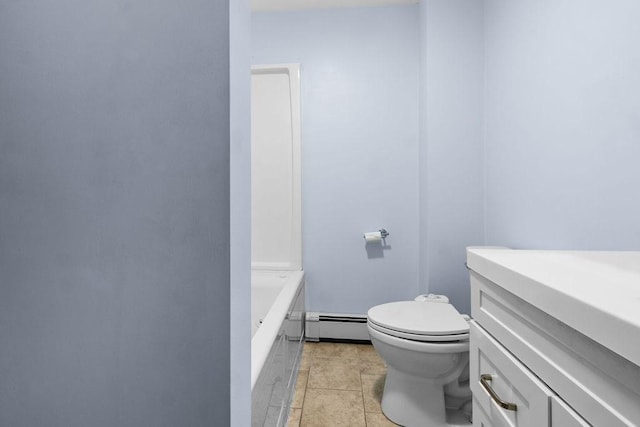 bathroom with a baseboard heating unit, a tub, toilet, and tile patterned floors