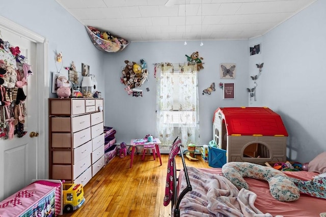 bedroom with wood finished floors