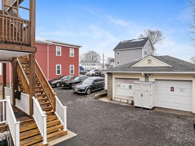 view of car parking featuring stairs