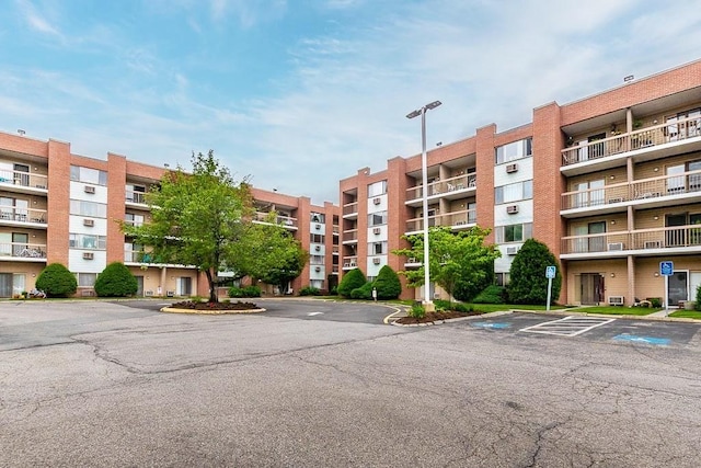 4975 Washington St Unit 313, Boston, MA 02132 - view of apartment building / complex featuring uncovered parking