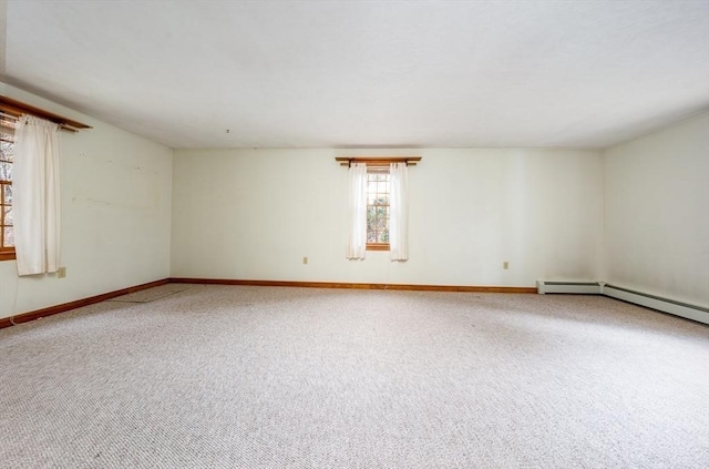 carpeted spare room with baseboards