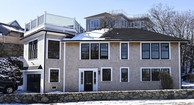 view of front of house with a balcony and a garage