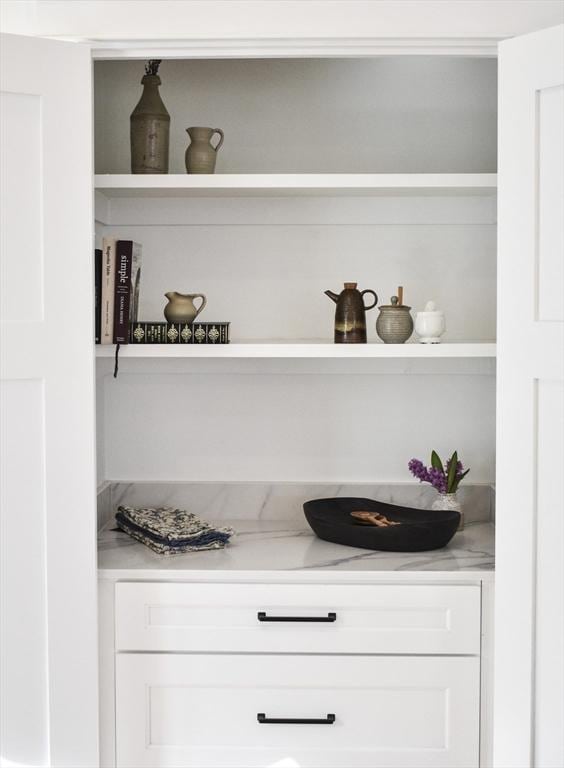 bar with white cabinetry