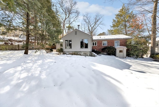 view of front of property featuring brick siding